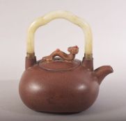 A CHINESE YIXING CLAY JADE HANDLE TEAPOT - the handle with a ruyi model with inset stones- the