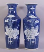 A LARGE PAIR OF CHINESE BLUE AND WHITE PORCELAIN VASES, painted with objects such as a vase on
