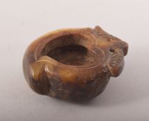 A SMALL CARVED HARDSTONE BRUSH WASH OR INK WELL, in the form of a fruit, 5.5cm.