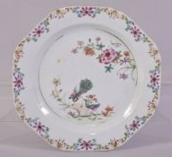 A CHINESE FAMILLE ROSE PORCELAIN PLATE, the centre painted with peacocks, mushrooms and native