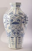 A LARGE CHINESE BLUE & WHITE OCTAGONAL PORCELAIN VASE - decorated with scenes of birds and flora -