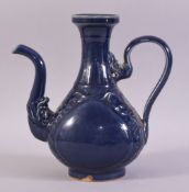 A CHINESE POWDER BLUE GLAZE WINE EWER, decorated with scrolling vines, (af), 24.5cm high.