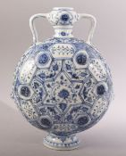 A CHINESE BLUE & WHITE MING STYLE PORCELAIN MOON FLASK - decorated with lotus display - 27cm