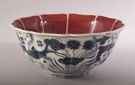 A CHINESE MING STYLE COPPER RED, BLUE & WHITE PORCELAIN LOBED BOWL - the bowl decorated with a