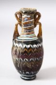 A MARVERED GLASS VESSEL / VASE, possibly Roman, 11cm high.