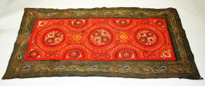 A UZBEK SUZANI EMBROIDERED TEXTILE, embroidered with decorative floral motifs, 190cm x 100cm.