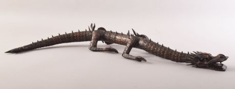 A SUPERB JAPANESE BOXWOOD RETICULATED MODEL OF A DRAGON, standing on four carved legs with a