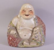 A CHINESE FAMILLE ROSE PORCELAIN FIGURE OF BUDDHA, with impressed mark to base, 23cm high.