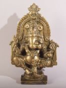 AN 18TH/19TH CENTURY INDIAN BRASS FIGURE OF GANESHA, 12.5cm high.