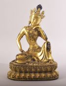 A FINE CHINESE OR TIBETAN GILT BRONZE BUDDHA, seated in a contemplative posture, 20cm high.
