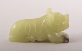 A SMALL CHINESE CARVED JADE FIGURE OF A BEAST, 6cm long.
