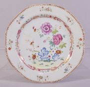 A CHINESE FAMILLE ROSE PORCELAIN PLATE, the centre painted with native flora, the border with