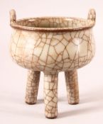 A CHINESE CRACKLE GLAZE TRIPOD CENSER, 15cm high, 12.5cm diameter.