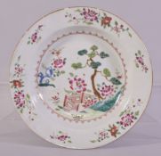 A CHINESE FAMILLE ROSE PORCELAIN SOUP DISH, the centre painted with native flora and with flowers to