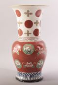 A LATE 19TH CENTURY JAPANESE RED AND WHITE VASE, the body painted with motifs of flowers and