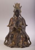 A GOOD CHINESE SEATED BRONZE FIGURE, with traces of gilt and red, the reverse with six character