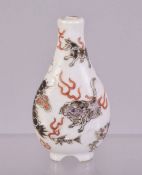 A SMALL CHINESE PORCELAIN SNUFF BOTTLE, painted with with mythical creatures, 6.5cm.