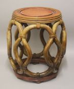 A CHINESE CARVED HARDWOOD BARREL TABLE / SEAT - with carved rope style openwork - 45cm