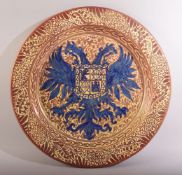 A LARGE ISLAMIC HISPANO MORESQUE LUSTRE GLAZE DISH, the dish with large emblem in blue and glazed in