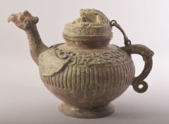 A CHINESE BRONZE ARCHAIC STYLE TEAPOT, with zoomorphic handle, spot and finial, 20cm high.