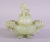 A CHINESE CARVED JADE KORO AND COVER, with carved ring handles, the cover with carved lion dog,