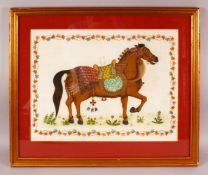 AN INDIAN PAINTING OF A HORSE ON SILK, with a floral border, framed and glazed, overall 55cm x