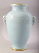 A CHINESE ROBINS EGG / CELADON GLAZED TWIN HANDLE VASE - with twin elephant mask handles and
