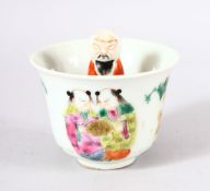 AN UNUSUAL CHINESE FAMILLE ROSE PORCELAIN CUP & FIGURE - the cup with decoration to the outside