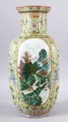 AN 18TH/19TH CENTURY CHINESE FAMILLE VERTE PORCELAIN VASE, painted with two panels of mountainous
