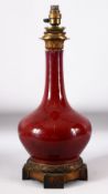 A CHINESE SANG DE BOEUF VASE / LAMP, with ormolu mounts, 51cm high.