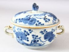 A CHINESE BLUE AND WHITE PORCELAIN ECULLE AND COVER, painted with native flora, 17.5cm diameter (