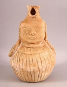 AN UNUSUAL EARLY SELJUK UNGLAZED POTTERY EWER, with the handle moulded as an animal, the ewer with a