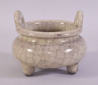 A CHINESE GE STYLE TWIN HANDLE TRIPOD CENSER, 13cm diameter.