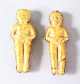 TWO GOLD OR GILT METAL FIGURAL PENDANTS, both approx 4cm (untested).