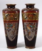 A PAIR OF JAPANESE CLOISONNE VASES, with panels of phoenix and dragons, both 24.5cm high.