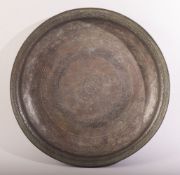 A LARGE 17TH CENTURY PERSIAN SAFAVID BRONZE DISH, with engraved decoration, the centre with a