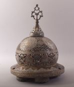 A SUPERB ISLAMIC SILVER AND COPPER OVERLAID OPENWORK BRONZE MOSQUE LAMP, the cover opening to reveal