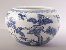 A CHINESE BLUE AND WHITE PORCELAIN BOWL / VASE, decorated with native flora, 24cm diameter.