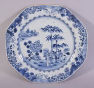 A CHINESE BLUE AND WHITE PORCELAIN DISH, painted with native flora, 22cm diameter.