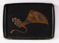 A JAPANESE MEIJI PERIOD LACQUER TRAY - decorated with a landscape view fan and tassel- 34cm x 24cm