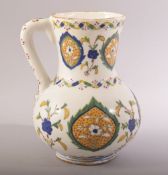 A TURKISH OTTOMAN GLAZED POTTERY KUTAHYA JUG, decorated with floral motifs, 21cm high.