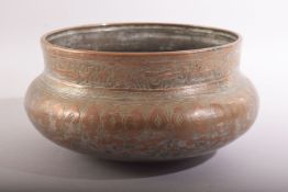 A GOOD ISLAMIC MAMLUK ENGRAVED AND CHASED COPPERED BRONZE BOWL, the rim with a band of calligraphy