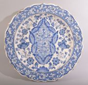 AN OTTOMAN STYLE, POSSIBLY EUROPEAN GLAZED POTTERY DISH, profusely decorated with floral sprays,