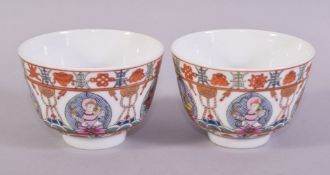 A PAIR OF UNUSUAL CHINESE PORCELAIN CUPS, painted with figures, animals and precious objects, the