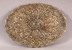 A TURKISH OTTOMAN SILVER MOUNTED MIRROR, with embossed decoration and hanging chain, 30.5cm x 22cm.