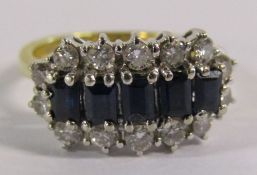 18ct gold ring with 5 baguette cut sapphires and 14 diamond surround - sapphire size approx 4mm -