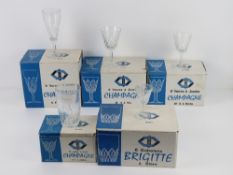 A set of French glassware all in original boxes being six champagne flutes, six port glasses,
