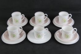 A set of five Susie Cooper trios each in Orchid design with white and blush pink ground,