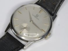 A vintage Omega wristwatch having silvered dial with subsidiary seconds dial, yellow metal hands,
