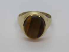 A mens signet style ring having large central tigers eye, uncarved, hallmark indistinct, size R, 4.